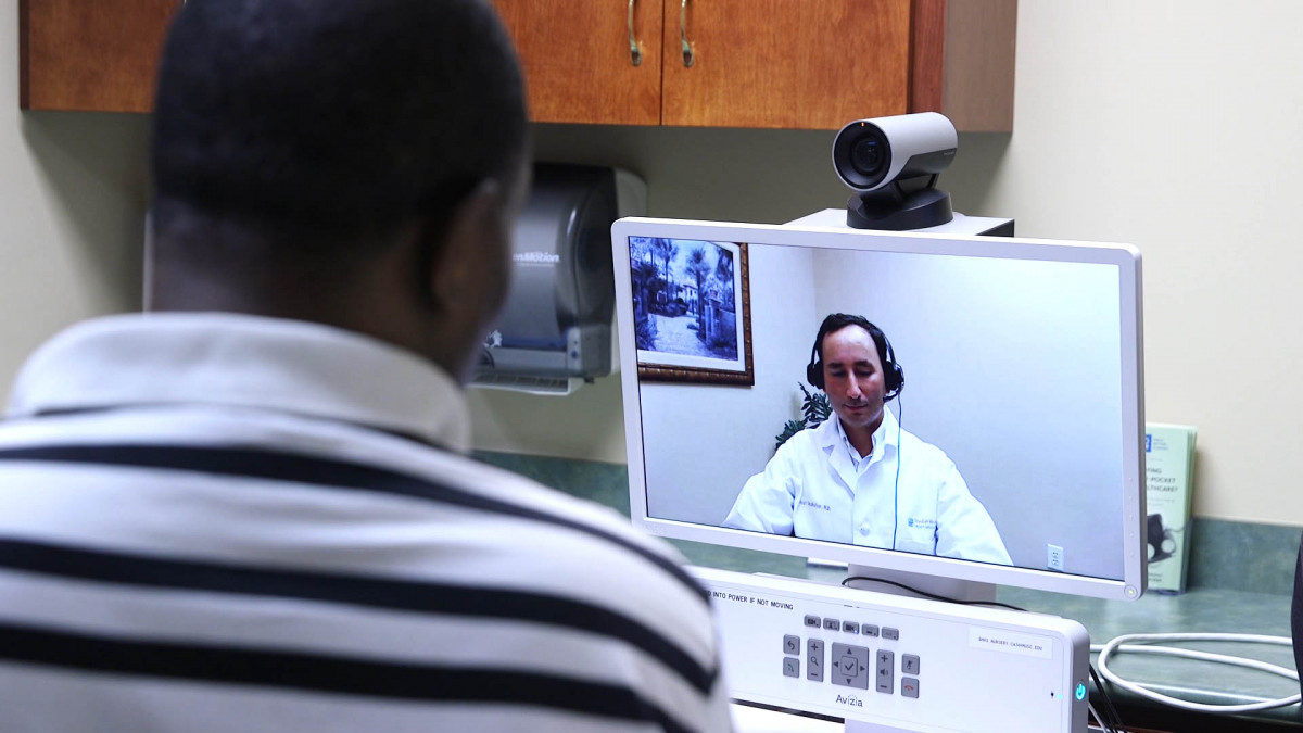 Patient talking to doctor using telehealth process