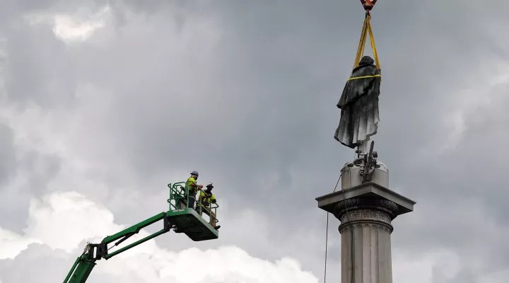 Crews work to remove the statue of John C. Calhoun from Charleston's Marion Square.  June 24, 2020.