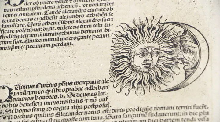 ancient text with sun and moon