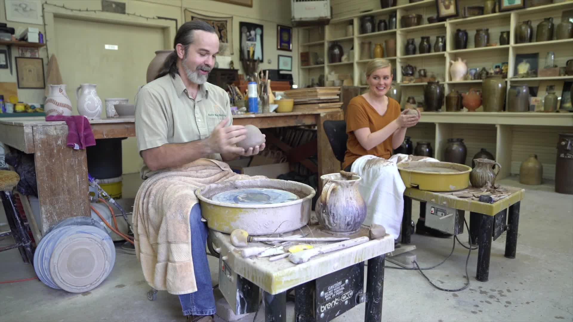 Man and woman making pottery