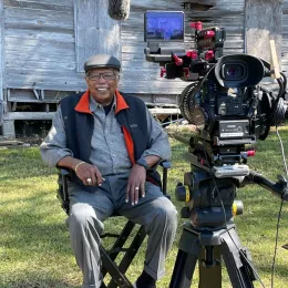 Leo Twiggs on set in front of his family home, built by his father in 1936