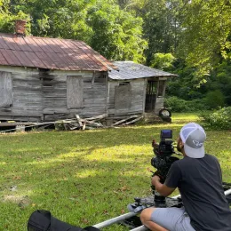 Videographer Shae Winston working on set