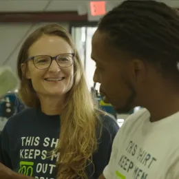 Amy Barch, Founder and Executive Director of Turn90 and Jeff, program participant at Turn90 shop