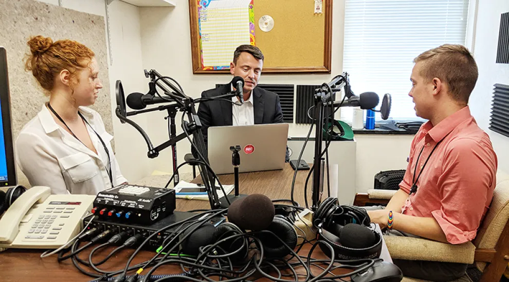 Gavin Jackson speaks with Mary Katherine Wildeman (l) and Michael Majchrowicz (r) in The Post and Courier's Charleston offices.