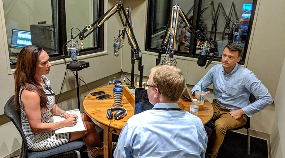 Gavin Jackson (r) speaks with Jamie Lovegrove and Meg Kinnard (l) on Thursday, June 21, 2018.