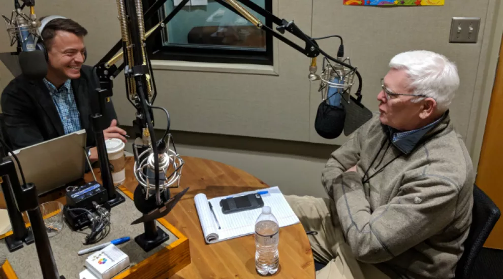 Gavin Jackson (l) speaks with Russ McKinney on Monday, March 26, 2018.