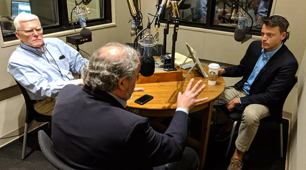 Gavin Jackson (r) speaks with Russ McKinney (l) and Andy Shain