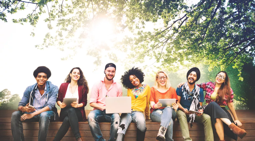 photo of several college students sitting next to each other