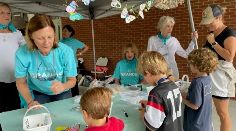 photo of JBE 'Grands' interacting with children at school event