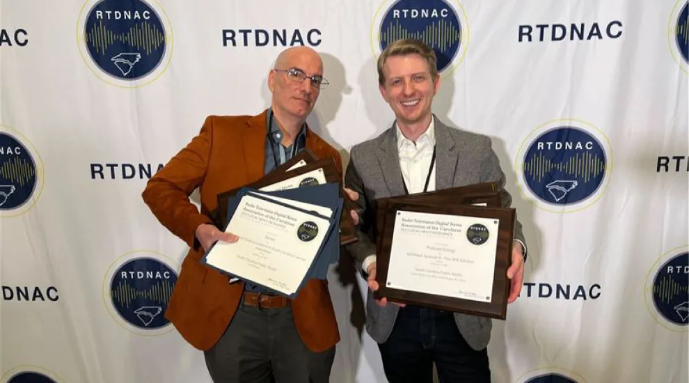 image of scott morgan and sean birch holding awards