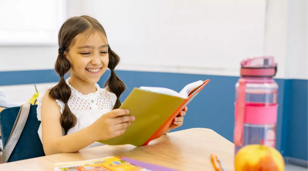 photo of a girl reading a book