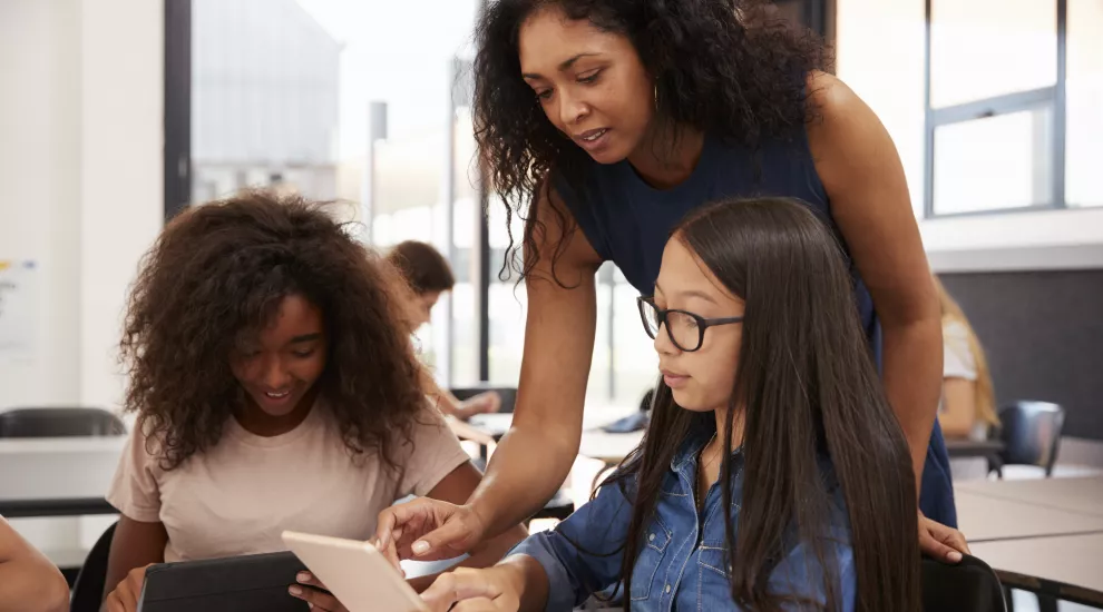 Teacher working with students