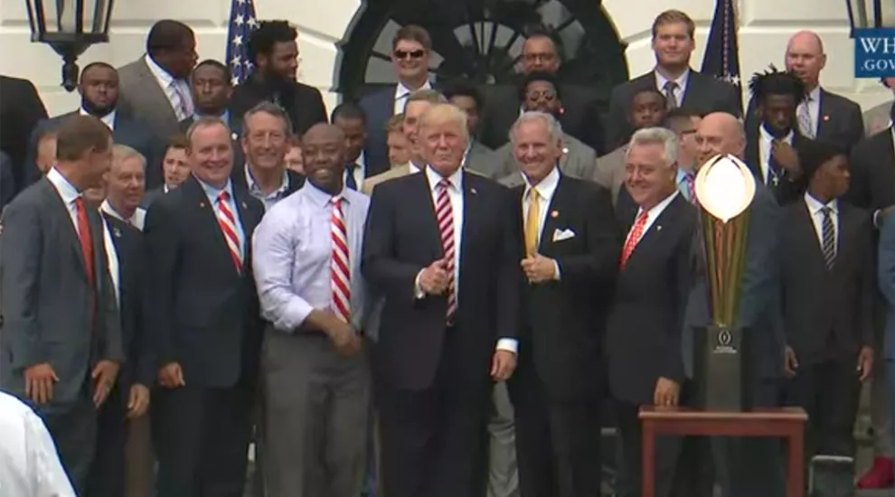 President Donald Trump stands with Clemson football team and South Carolina politicians at the White House on June 12, 2017.