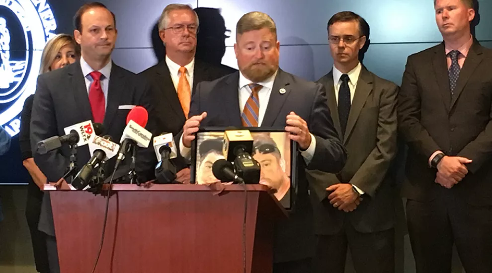 S.C. Rep. Eric Bedingfield holds a picture of his son who died from an overdose in 2016. 