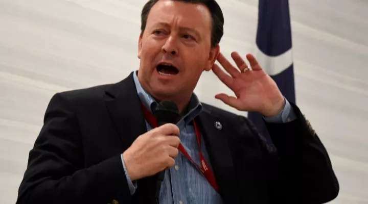 South Carolina Republican Party Chairman Drew McKissick gestures as he speaks to the Richland County GOP convention on Friday, April 30, 2021, in Columbia, S.C. (AP Photo/Meg Kinnard)