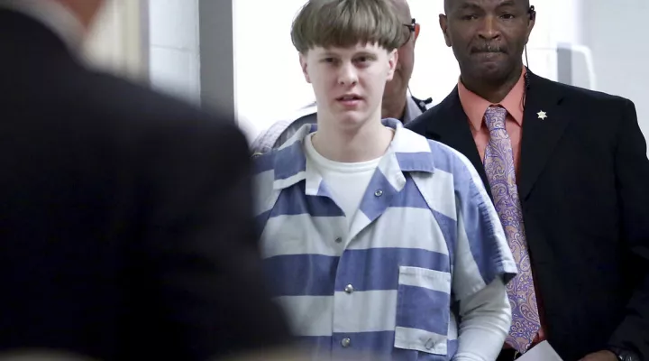 FILE - In this April 10, 2017, file photo, Dylann Roof enters the courtroom at the Charleston County Judicial Center in Charleston, S.C. On Tuesday, May 25, 2021, Roof, on federal death row for the racist slayings of nine members of a Black South Carolina congregation, is making his appellate argument that his conviction and death sentence should be overturned. (Grace Beahm/The Post And Courier via AP, Pool, File)