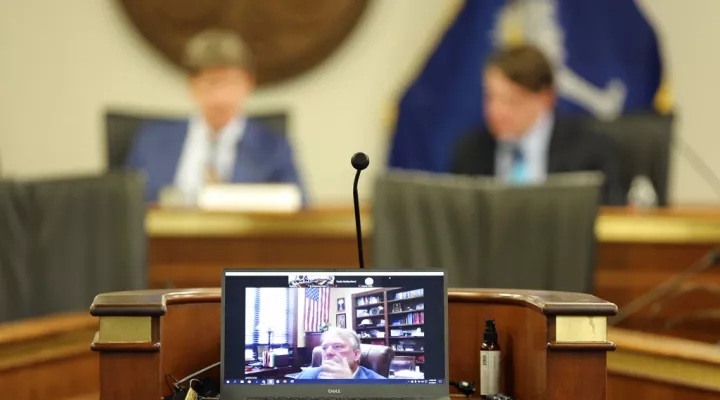 Senate Minority Leader Brad Hutto, D-Orangeburg, listens online during a meeting over a Santee Cooper overhaul bill on Tuesday, June, 1, 2021, in Columbia, S.C. Powerful legislative leaders reached a compromise on the bill that will be considered at a special session. (AP Photo/Jeffrey Collins)