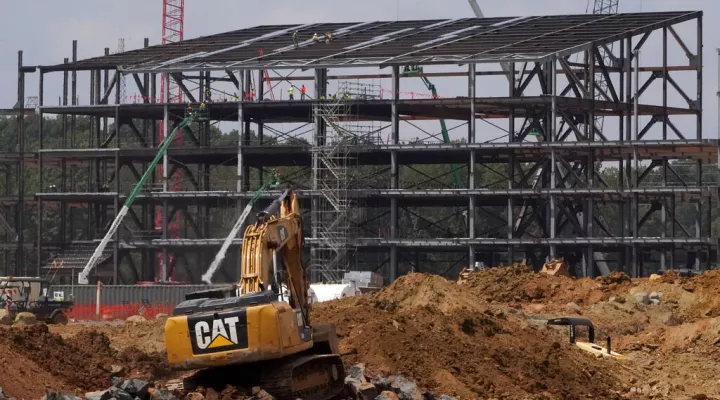 Construction personnel work on Carolina Panthers' state-of-the-art team headquarters and practice facility Tuesday, Aug. 24, 2021, in Rock Hill, S.C. "The Rock" will host all of the team's offices and training/locker room facilities, along with three outdoor grass practice fields, one indoor artificial field and another outdoor artificial field that is part of a 5,000-seat multipurpose stadium that can also be used to host high school football and soccer games, concerts, car shows and much more. (AP Photo/…