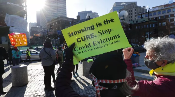 FILE - In this Jan. 13, 2021 file photo, tenants' rights advocates demonstrate outside the Edward W. Brooke Courthouse in Boston. States have begun to ramp up the amount of rental assistance reaching tenants but there are still millions of families facing eviction who haven't gotten help. The Treasury Department says just $5.1 billion of the estimated $46.5 billion in federal rental assistance, or only 11%, has been distributed by states and localities through July. (AP Photo/Michael Dwyer, file)