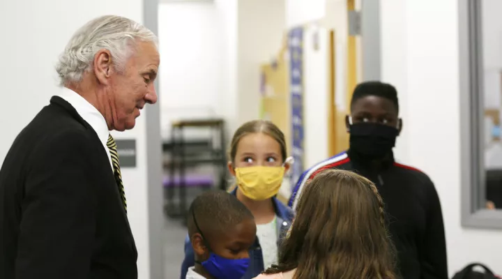 FILE - Camden Elementary School students in masks listen as South Carolina Gov. Henry McMaster talks to them on Wednesday, Sept. 15, 2021, in Camden, S.C.  A federal judge Tuesday, Sept. 28 suspended South Carolina from enforcing a rule that banned school districts from requiring masks for students. Parents of disabled children, helped by the American Civil Liberties Union, sued the state saying the ban discriminated against medically vulnerable students by keeping them out of public schools as the COVID-1…