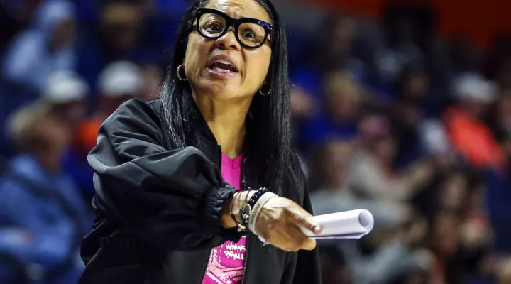 FILE - In this Feb. 27, 2020, file photo, South Carolina head coach Dawn Staley reacts to an official's call during the second half of an NCAA college basketball game against Florida in Gainesville, Fla. Dawn Staley and South Carolina have agreed to a new, seven-year contract that will pay her $2.9 million this season and grow to $3.5 million in the final season.  The school's Board of Trustees approved the deal worth $22.4 million on Friday, Oct. 15, 2021, to keep the national championship coach with the …