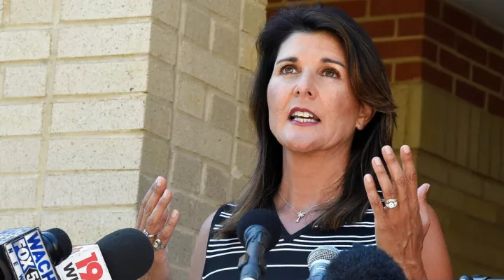 FILE - Former South Carolina Gov. Nikki Haley speaks with reporters after a campus tour of South Carolina State University on April 12, 2021, in Orangeburg, S.C. (AP Photo/Meg Kinnard)