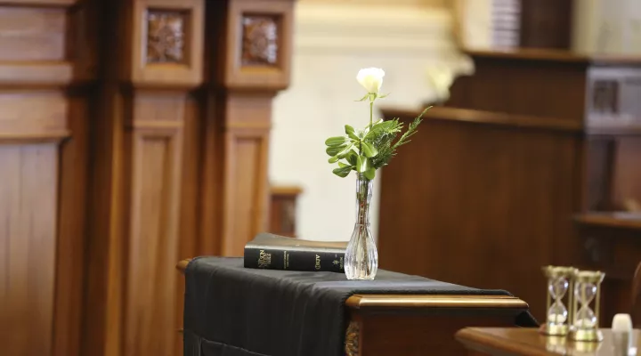 A single rose sits in the late Senate Finance Committee Chairman Hugh Leatherman's seat, which is draped in black on Monday, Dec. 6, 2021, in Columbia, S.C. The 90-year-old Florence Republican died Nov. 12 after serving more than 41 years in the Senate. (AP Photo/Jeffrey Collins)