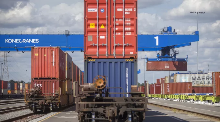 A rail mounted gantry crane lifts a 40-foot shipping container and loads it onto a rail car at the Georgia Ports Authority Mason Mega Rail Terminal, Thursday, Oct. 21, 2021, in Savannah, Ga. The Georgia Ports Authority has announced it has opened all 18 working tracks at its rail terminal increasing the port's intermodal capacity by more than 30 percent. (AP Photo/Stephen B. Morton)