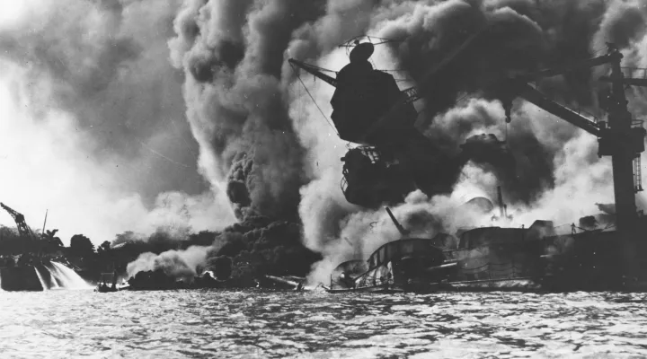 The USS Arizona on fire after Japanese forces attacked American military facilities in Pearl Harbor, HI, on Dec. 7, 1941.