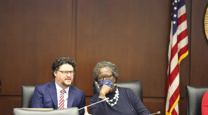 South Carolina House Majority Leader Gary Simrill, left, R-Rock Hill, and Rep. Gilda Cobb-Hunter, right, D-Orangeburg, talk before a House Ways and Means Committee meeting to consider a bill banning businesses to require COVID-19 vaccines for employees on Thursday. Dec. 9, 2021, in Columbia, S.C. Business groups oppose the bill, setting up a topsy-turvy showdown in the House. (AP Photo/Jeffrey Collins)