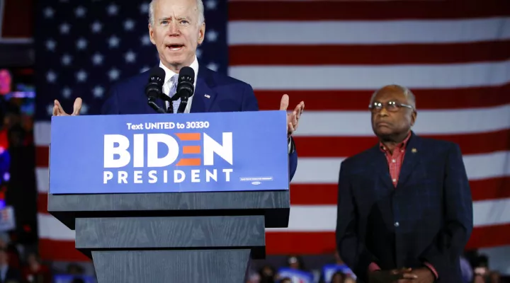 FILE - Democratic presidential candidate former Vice President Joe Biden speaks at a primary night election rally in Columbia, S.C., Feb. 29, 2020, after winning the South Carolina primary, as Rep. James Clyburn, D-S.C., watches.  (AP Photo/Matt Rourke, File)