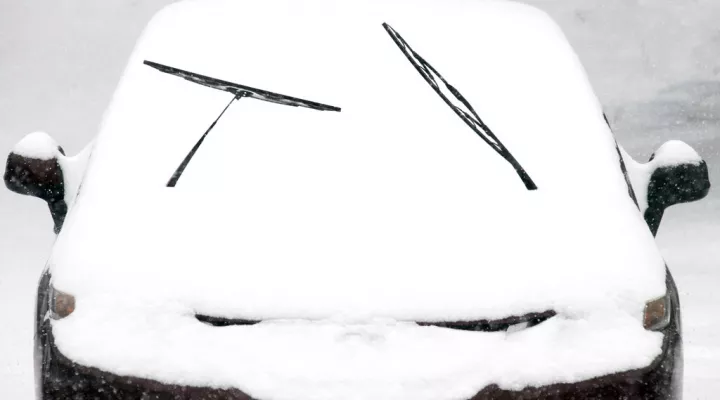 A motorist leaves wiper blades exposed in anticipation of heavy snowfall in Southwest Roanoke City on Sunday, Jan. 16, 2022, in Roanoke, Va. (AP Photo/Don Petersen)