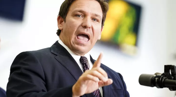 FILE - Florida Gov. Ron DeSantis speaks to supporters and members of the media after a bill signing on Nov. 18, 2021, in Brandon, Fla. DeSantis is taking the unusual step of asking his state's Supreme Court to advise whether Democratic Rep. Al Lawson's district can be broken up.  For decades, Lawson's district has stretched like a rubber band from Jacksonville to Tallahassee, scooping up as many Black voters as possible to comply with requirements that minority communities get grouped together so they can …