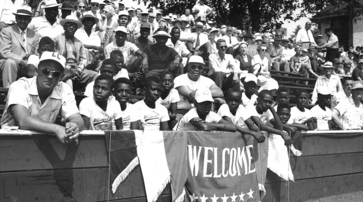  The Cannon Street All-Stars watch from the stands at the 1955 Little League World Series in Williamsport, Pennsylvania. 