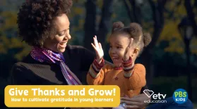 photo of a smiling woman holding a smiling child